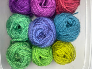 12 little balls of Shetland hand dyed 4 ply yarn